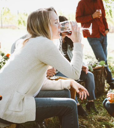 girl drinking a glass of wine